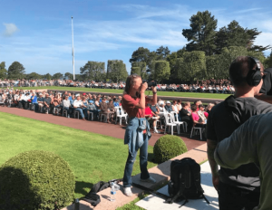 Savannah photographing the 2018 Memorial Day Ceremony at the Normandy American Cemetery