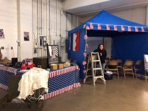 Vicki Sullivan helping set up to show "The Girl Who Wore Freedom" Trailer at Peoria, IL Honor Flight Breakfast November, 2018