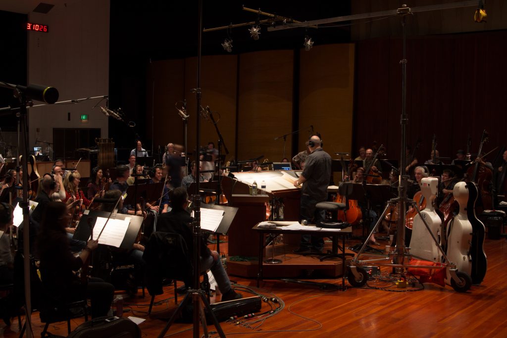 Jeff Kurtenacker, lead composer on The Girl Who Wore Freedom, conducting at Warner Brothers