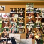 A wall of photos with names listing each person interviewed for The Girl Who Wore Freedom