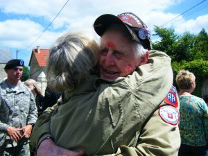 A WWII Veteran being hugged in France