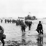 US Troops disembarking on the beaches of Normandy