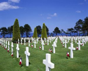 Many tombstones with flags