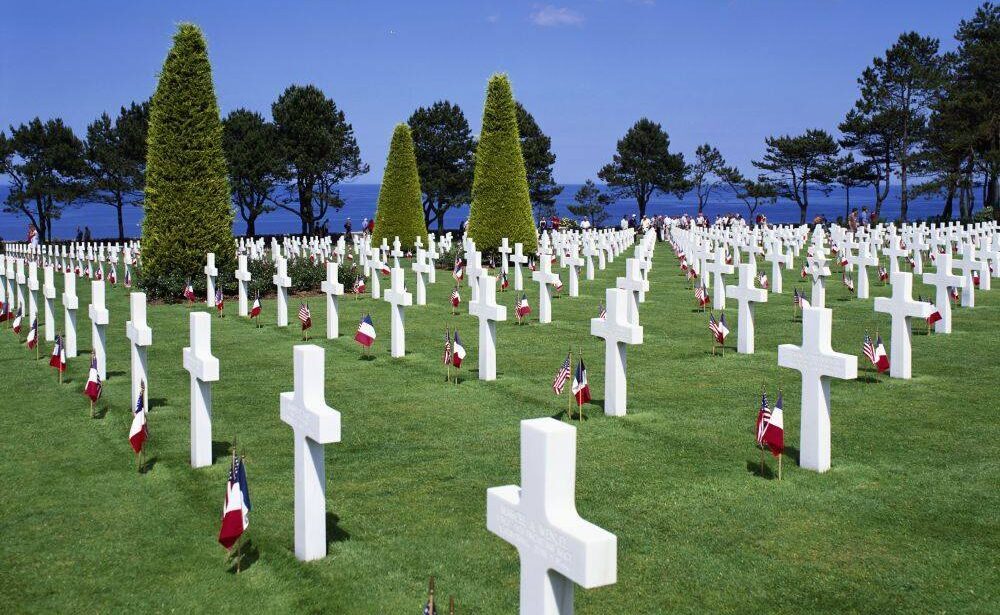 Many tombstones with flags