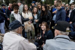 Michele translating for veterans in France.